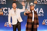T.J. Osborne, left, and John Osborne of Brothers Osborne celebrate CMA Award for best vocal duo 