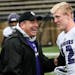 Winona State coach Tom Sawyer, pictured with Will Clausen, is retiring.
