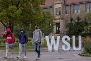 Students walked on the campus of Winona State University in September 2020.