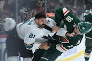 San Jose Sharks defenseman Jacob Middleton and Minnesota Wild left wing Jordan Greenway fight in the first period Tuesday, Nov. 16, 2021 at the Xcel E
