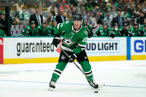Dallas Stars defenseman Ryan Suter prepares to make a pass during an NHL hockey game against the Detroit Red Wings in Dallas, Tuesday, Nov. 16, 2021. 
