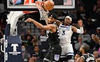 Kings’ Marvin Bagley III, left, and the Timberwolves’ Jaden McDaniels try for a rebound Wednesday.