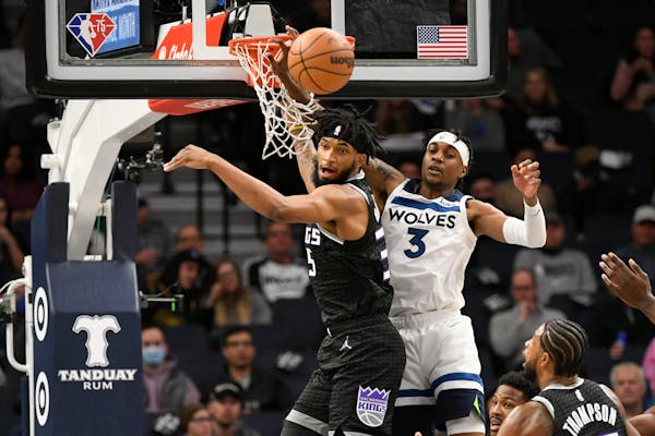Kings’ Marvin Bagley III, left, and the Timberwolves’ Jaden McDaniels try for a rebound Wednesday.
