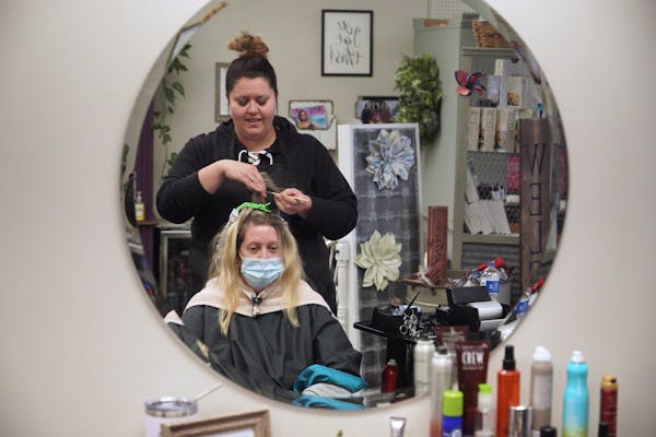 Brittney Ewert, owner of Glamour Salon in downtown Wadena, Minn., is not vaccinated and has already had COVID-19 but honors her clients’ requests if