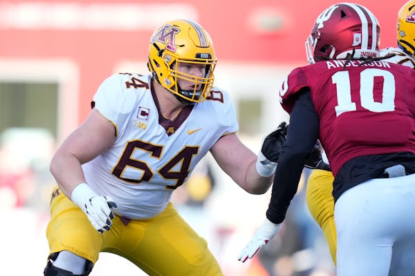 Gophers guard Conner Olson (64) defended against Indiana defensive lineman Ryder Anderson in the first half Saturday.