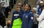 Wolves guard Anthony Edwards, right, and forward Taurean Prince enjoyed the final minutes of Saturday night’s rout of the Grizzlies.