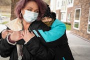 Laurie Eastwood hugged Wanda Grady, left, outside Wings of Newport apartments on Friday, Nov. 19, 2021, in Newport. They were recently told they have 