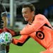Minnesota United goalkeeper Tyler Miller blocks a shot by San Jose Earthquakes during the first half of an MLS soccer match, Saturday, Aug. 1, 2020, i