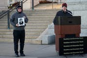 Former Secretary of State Mark Ritchie, right, remembered his daughter Rachel, who was killed by a drunk driver in 2000. A photo of Rachel is held up 