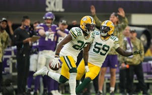 Green Bay Packers free safety Darnell Savage (26) reacted after he intercepted a pass meant for Minnesota Vikings wide receiver Justin Jefferson (18) 