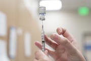 A health care worker prepared a dose of the Pfizer-BioNTech Covid-19 vaccine at an Oklahoma County Health Department Vaccine Clinic in Oklahoma City o