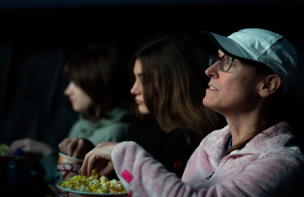 Elsa Meier, 12, her sister, Rosie, 17, and mother, Kelly, watched “Venom: Let There Be Carnage” in Woodbury.
