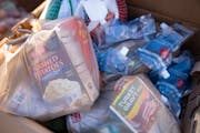 Prepackaged bags of side dishes and fixings sat in boxes during ICA Food Shelf’s Turkey Distribution Day on Saturday in Minnetonka. The food shelf h