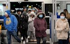 Shoppers enter Best Buy at 5 a.m., looking for Black Friday deals Friday, Nov. 26, 2021 in Maplewood, Minn. 