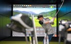 Tommy Kramer tested a driver during a private fitting at 2nd Swing golf store in Minnetonka. Sales companywide jumped 15% in 2020 and are on pace to i