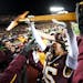 Coney Durr hoisted Paul Bunyan’s Axe in triumph after the Gophers defeated Wisconsin 23-13 at Huntington Bank Stadium on Nov. 27, 2021.