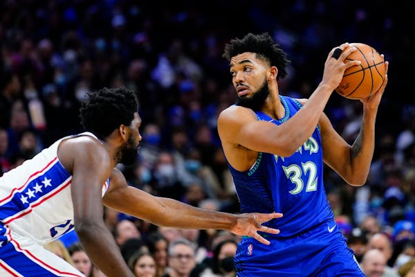 Karl-Anthony Towns tries to get past the 76ers’ Joel Embiid on Saturday.