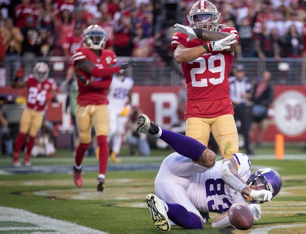 Minnesota Vikings tight end Tyler Conklin (83) can’t make the catch for in the end zone as San Francisco 49ers safety Talanoa Hufanga (29) signs no 