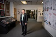 Txong Pao Lee poses for a photo in the new addition to the Hmong Cultural Center on Tuesday, Nov. 23, 2021 in St. Paul, Minn. Pao is the director of t
