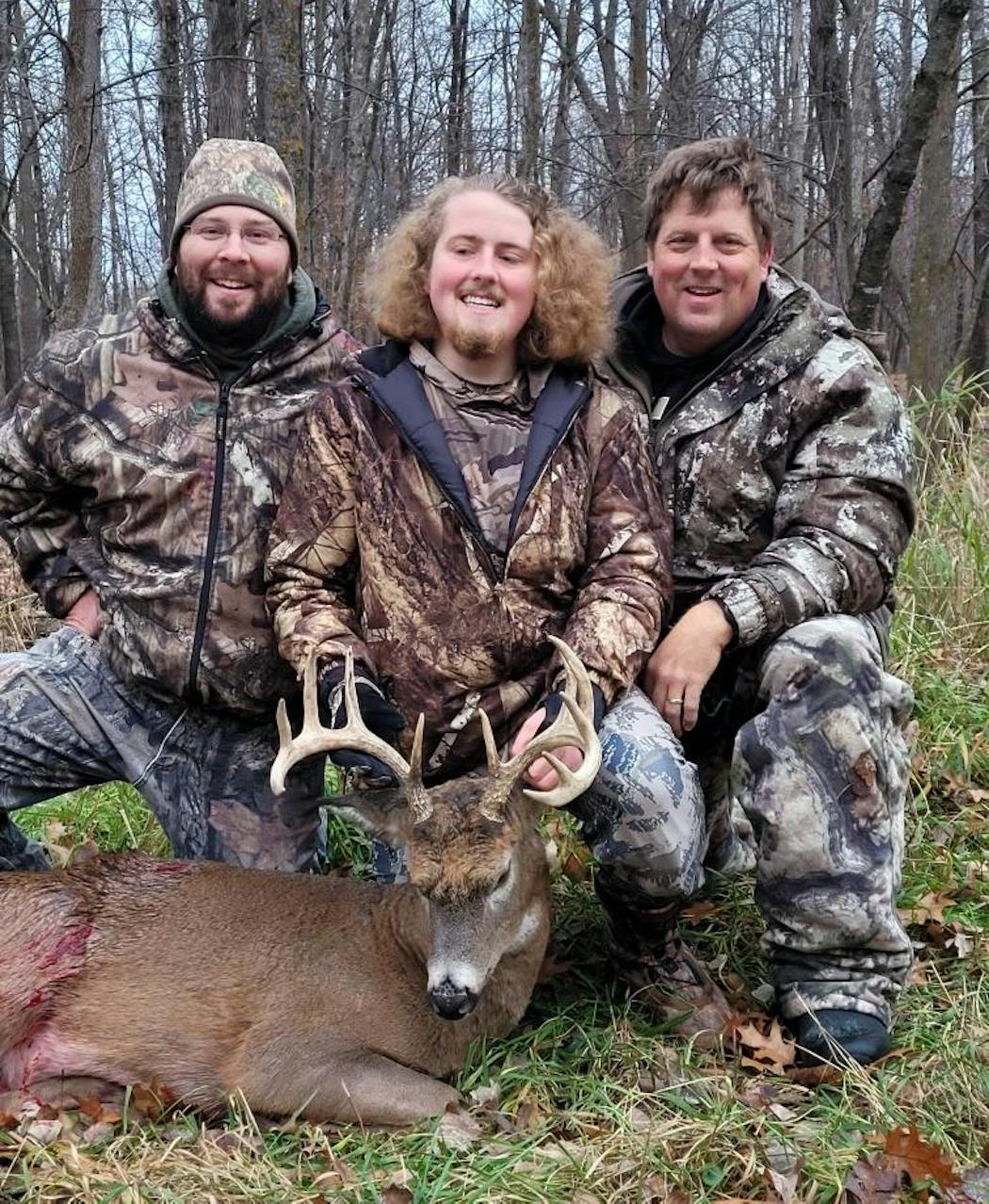 Josh Peterson’s fall harvest of five whitetails this year included this buck shot Nov. 13 at Autumn Antlers, a high-fence hunting facility in Morrison County. Josh, center, was blinded by a stroke at 14. He won the guided hunt at a silent auction. He is flanked by his father, Chad (right) and friend Chris Gehrig.