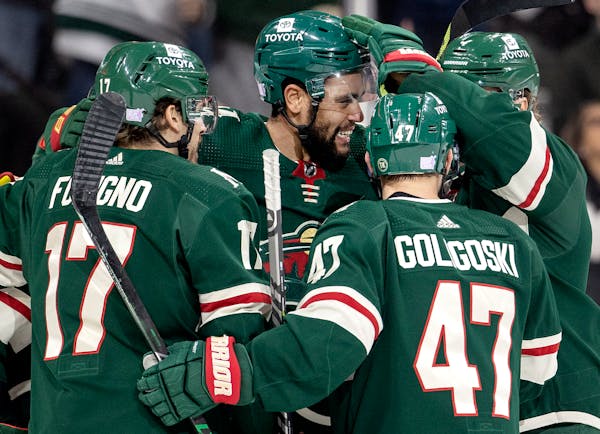 Jordan Greenway of the Wild celebrates with teammates after scoring in the second period on Nov. 30.