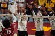Melani Shaffmaster (5), Katie Myers (23) and Airi Miyabe (8) form a wall against Wisconsin earlier this season. The Gophers open the NCAA volleyball t