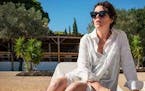 Olivia Colman plays a writer whose trip to the beach is no day at the beach in “The Lost Daughter.”