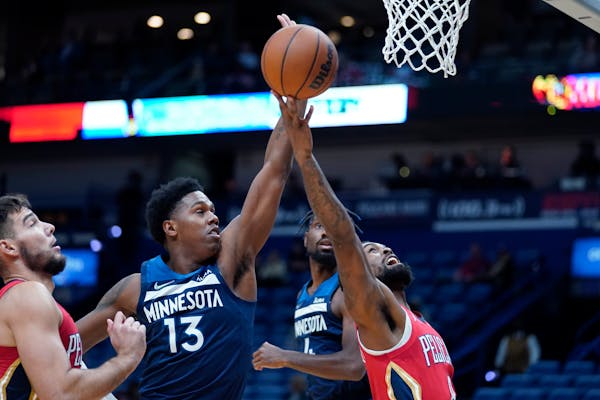 Wolves forward Nathan Knight (13, shown against the Pelicans on Nov. 22) recently impressed coaches with his play when stepping in for injured center 