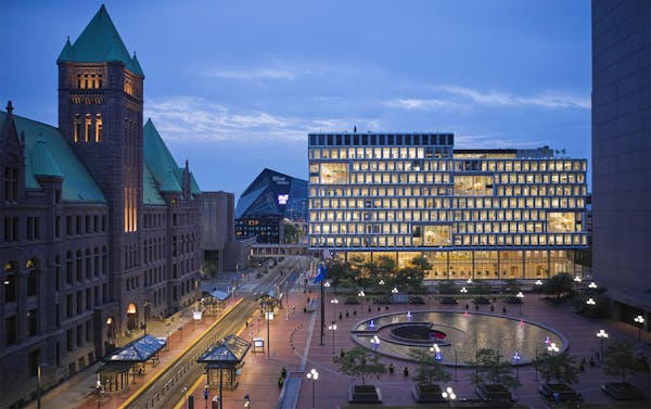 The City of Minneapolis Public Service Building in downtown Minneapolis shares a public plaza with City Hall, left, and the Hennepin County Government
