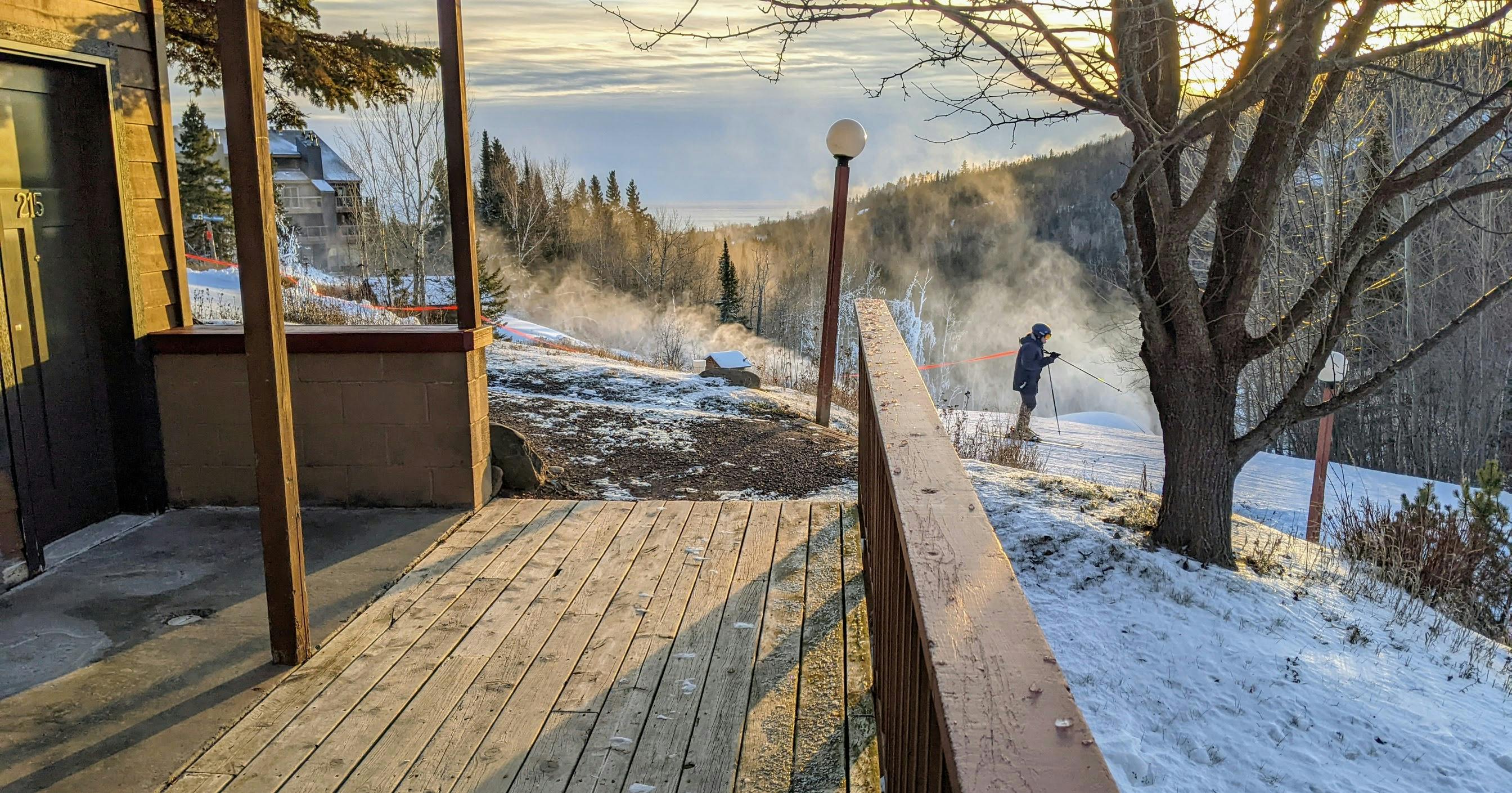 A skier zips past the ski-in, ski-out lodging at Eagle Ridge Resort at Lutsen.