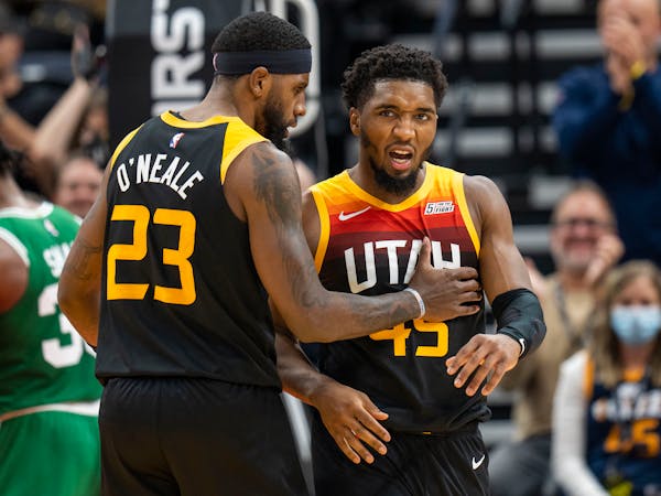 Royce O’Neale met a fired up Jazz teammate Donovan Mitchell during a Dec. 3 game in Salt Lake City.
