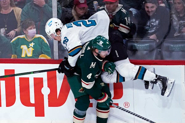 The Sharks’ Jasper Weatherby was upended by the Wild’s Jon Merrill in the teams’ first meeting of the season, a 4-1 San Jose victory at Xcel Ene