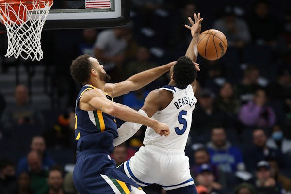 Utah center Rudy Gobert knocks the ball out away from Timberwolves guard Malik Beasley during the first half Wednesday.
