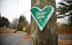 A small remembrance of the mass shooting at Sandy Hook Elementary is nailed to a utility pole in Newtown, Conn., on Dec. 2, 2017. 