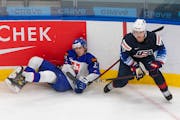 United States’ Brock Faber checked Slovakia’s Rayen Petrovicky (12) during last year’s world junior tournament in Edmonton.