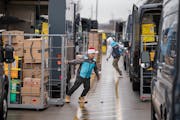 Luis Juncal loaded his truck at the Amazon distribution center in Maple Grove on Wednesday. This week is the busiest of the holiday mailing and shoppi
