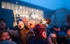 The crowd lit their sparklers from one another at the Winter Solstice celebration at the American Swedish Institute on Dec. 22, 2015