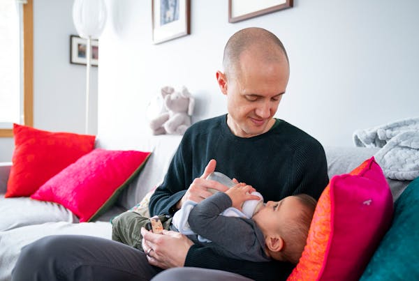 Seth Snyder feeds his 8-month-old son with donated breastmilk in their Minneapolis home. “It’s like I’m getting an act of love, often from a str