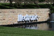 The Medronic logo was reflected in a lake at the Minnesota headquarters in Fridley in 2019. The legal headquarters of Medtronic is in Ireland.