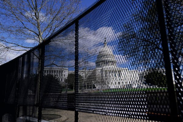 The U.S. Capitol is seen behind security fencing on Capitol Hill in Washington, D.C., in April.