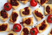 Tomato Jam Tartlets can be made in advance and served warm or at room temperature.