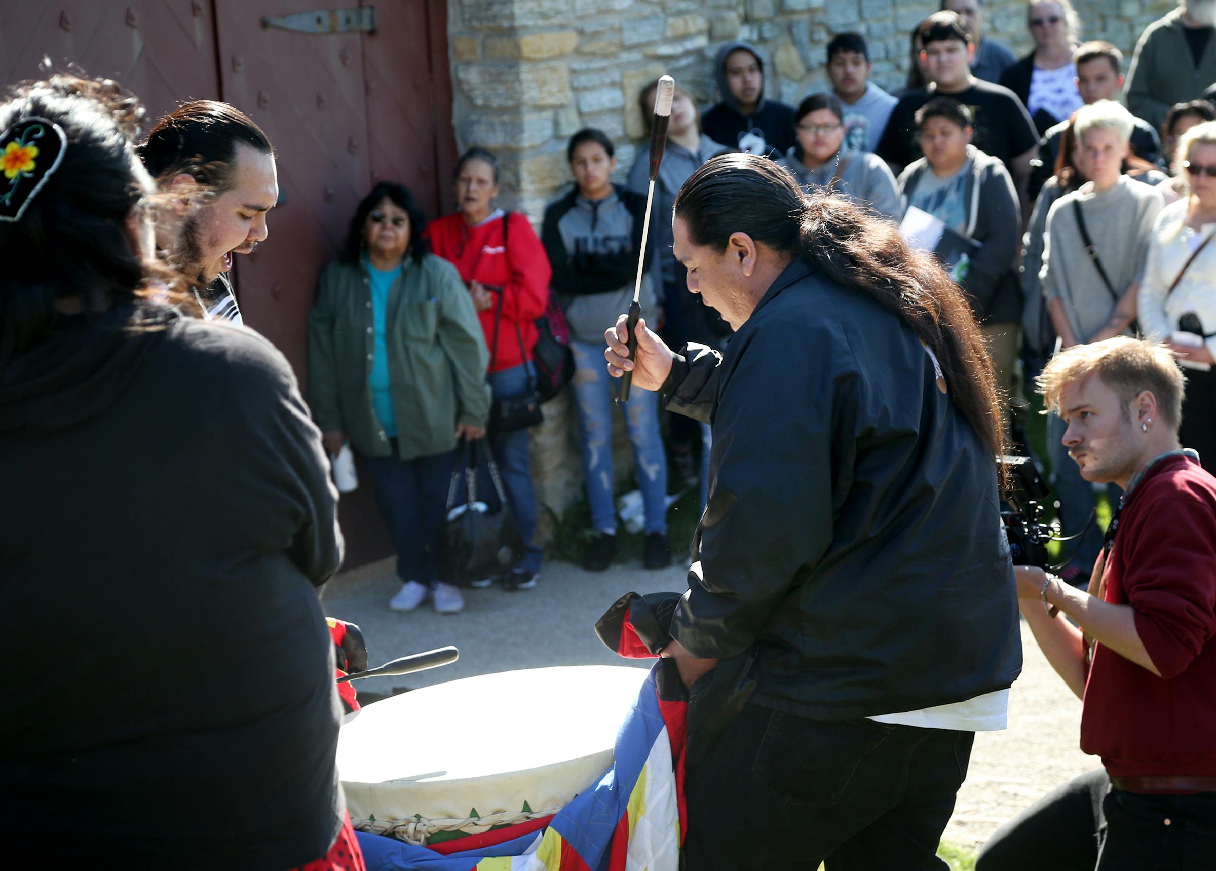 Members of the Hoka Hey drum group drummed and sang during an opening ceremony before Dakota people and others entered the gates of Fort Snelling during the Dakota Truth-Telling Gathering in 2017.