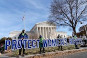 Abortion rights advocates demonstrate in front of the U.S. Supreme Court on Dec. 1, in Washington. 