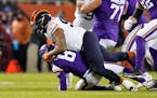 Chicago Bears defensive end Akiem Hicks sacks Minnesota Vikings quarterback Kirk Cousins during the first half of an NFL football game Monday, Dec. 20
