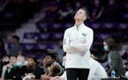 Green Bay head coach Will Ryan looks at the scoreboard during the second half of an NCAA college basketball game against Kansas State, Sunday, Dec. 12