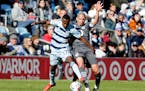 Sporting Kansas City midfielder Gadi Kinda (17) and Minnesota United midfielder Ozzie Alonso vied for the ball during an Oct. 31 match in St. Paul. 