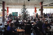 Shoppers drank and toured the tables during a homemade craft fair inside Lakes & Legends Brewing Company in Minneapolis on Dec. 11.