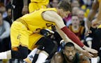 Greg Monroe, bottom, was playing for the Bucks in 2017 when he was pinned by Cleveland’s Kyle Korver.