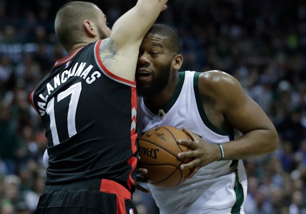 New Wolves big man Greg Monroe (right, shown with Milwaukee in 2017) got quality minutes against the Celtics on Monday night in his first NBA game in 