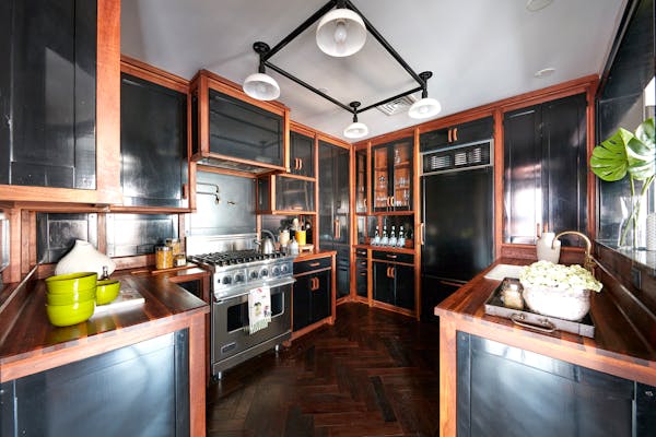 Black cabinetry makes a powerful statement in this kitchen.